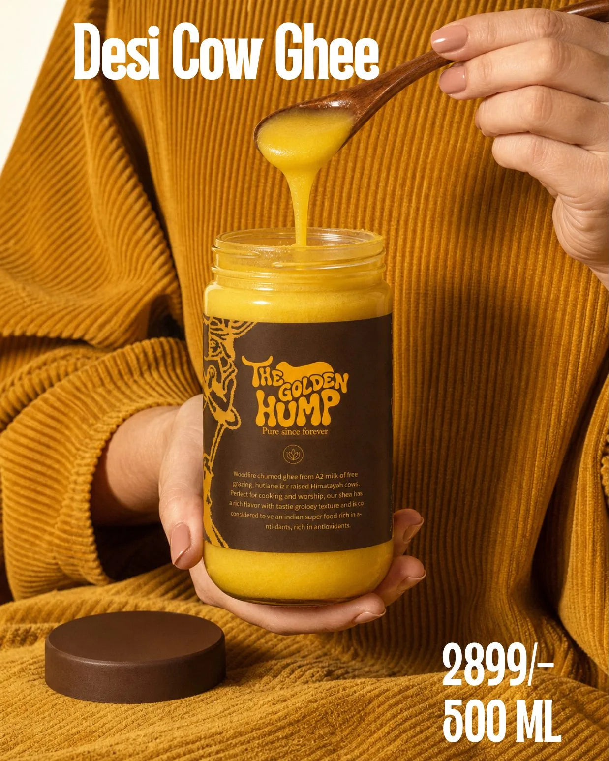 Golden kavvam ghee dripping from a wooden spoon into a Golden Hump jar